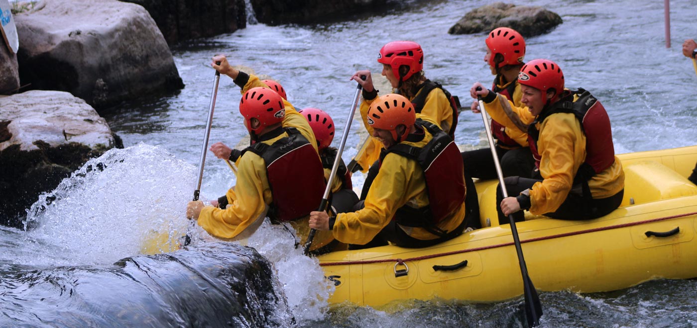 A group of people rafting on river Brenta