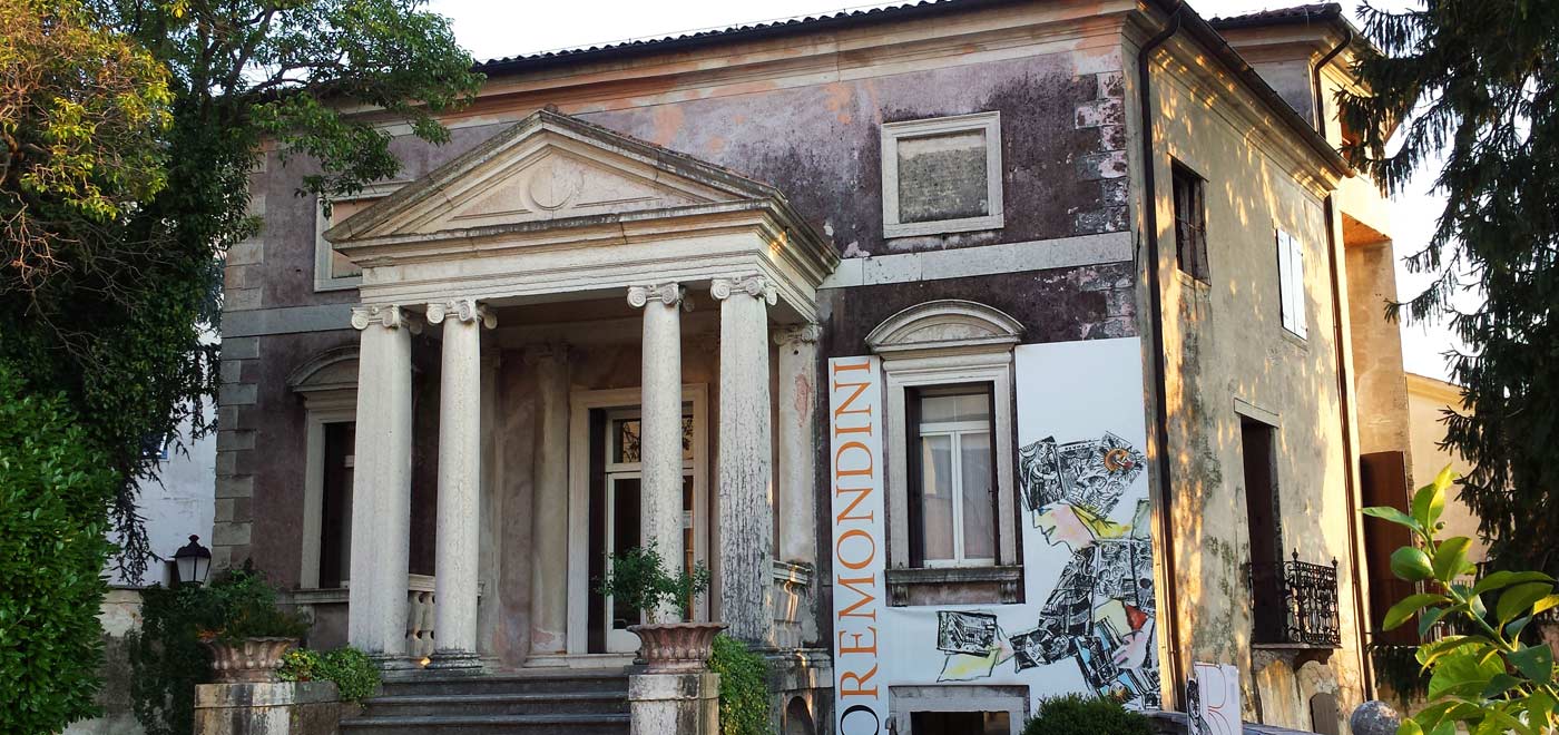 The main facade of an ancient building located in the Montegrappa area