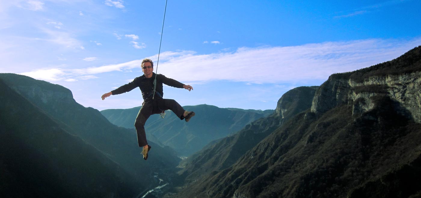 A climber dropping from a rope while climbing