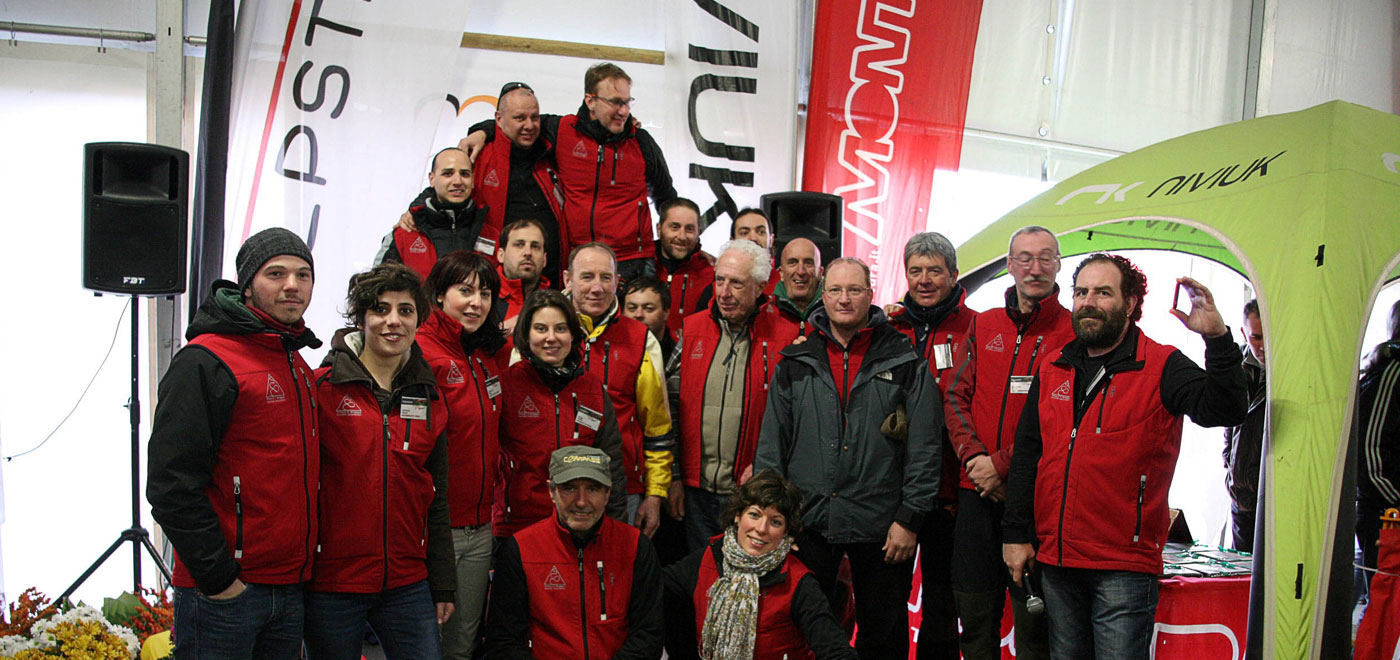 Members of the tourist consortium Vivere il Grappa in a group photo taken during a fair