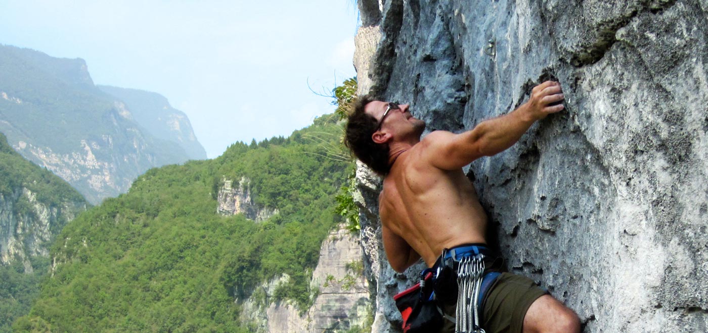 Climber climbing on a rocky wall